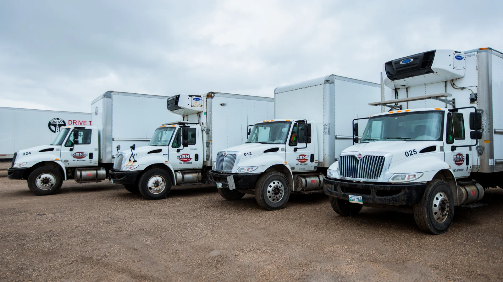 DBNS straight trucks and refrigerated trucks at the yard